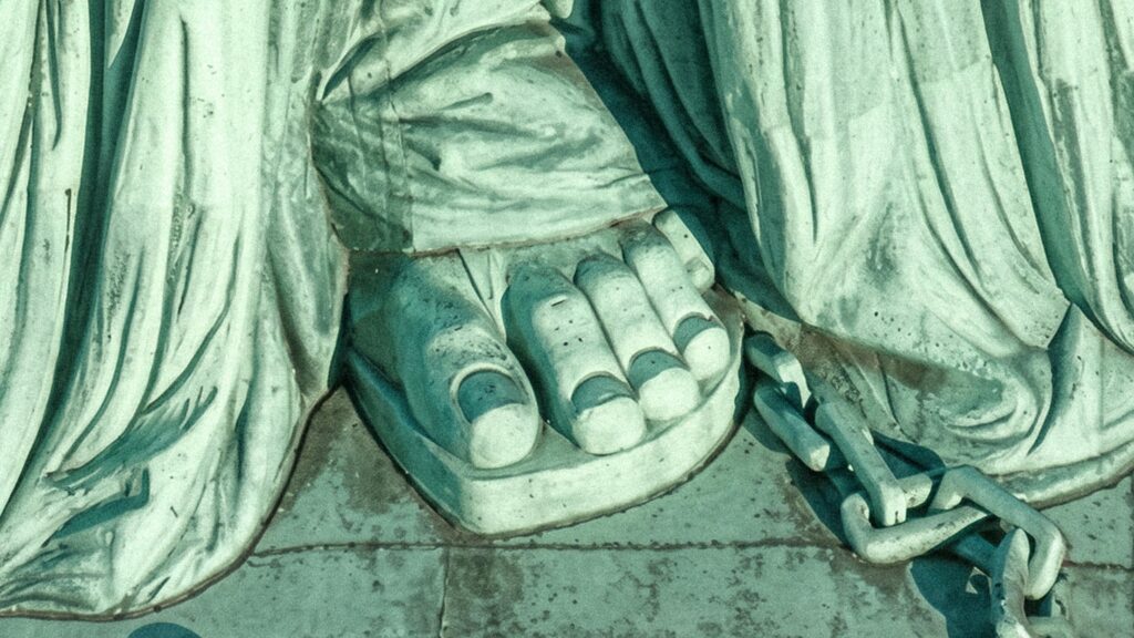 This close up shot shows the toes of the Statue of Liberty.